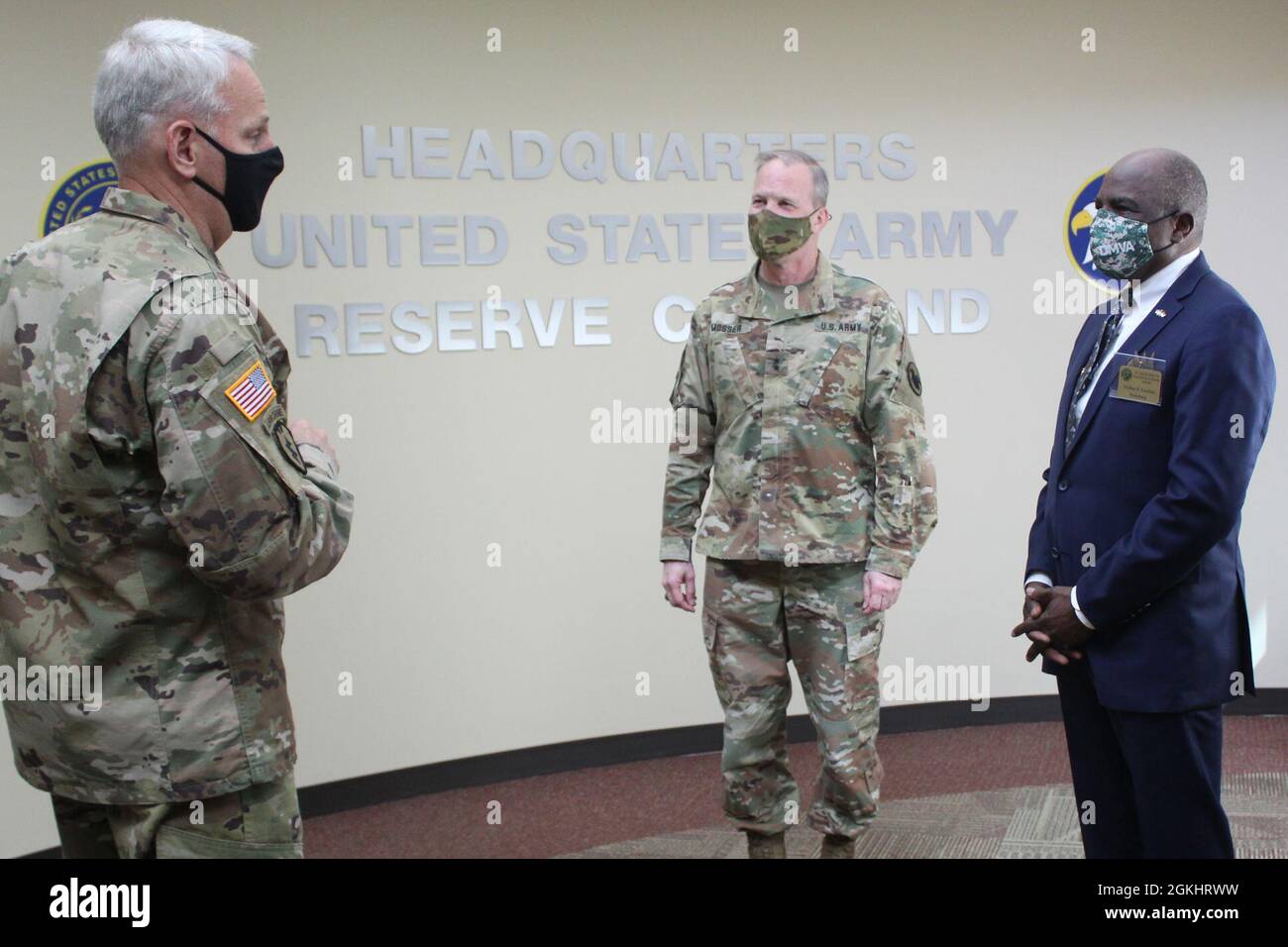 Maj. Gen. Gregory J. Mosser, center, deputy commanding general, U.S. Army Reserve Command, and Brig. Gen. Robert S. Cooley Jr., left, U.S. Army Reserve Command chief of staff, welcome retired United States Marine Corps Lt. Gen. Walter Gaskin to U.S. Army Reserve Command headquarters at Fort Bragg, N.C., April 27, 2021. Gaskin currently serves as secretary of the North Carolina Department of Military and Veterans Affairs. Stock Photo