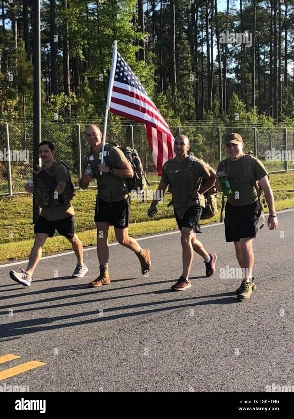 A team rucks a portion of the 4.75 mile route during the 1st Annual ...