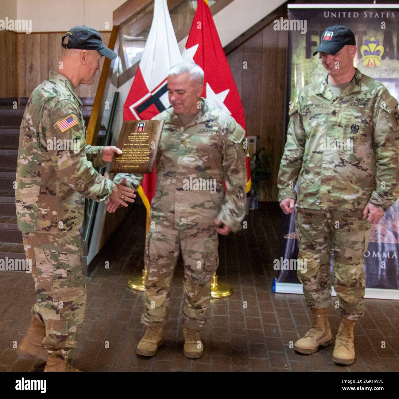 U.S. Army Lt. Gen. Thomas S. James, Jr., First Army commanding general (left), and Command Sgt. Maj. John P. McDwyer, First Army command sergeant major (far right), presents the First Army Individual Award of Excellence in Safety to Maj. William E. Ponder, motorcycle safety coordinator, G-3 future operations officer for Division West, First Army, during an awards ceremony held at Division West Headquarters in Fort Hood, Texas, April 27. Ponder’s oversight of the Motorcycle Training Program was selected as the best safety program across the Division. The First Army Individual Award of Excellenc Stock Photo