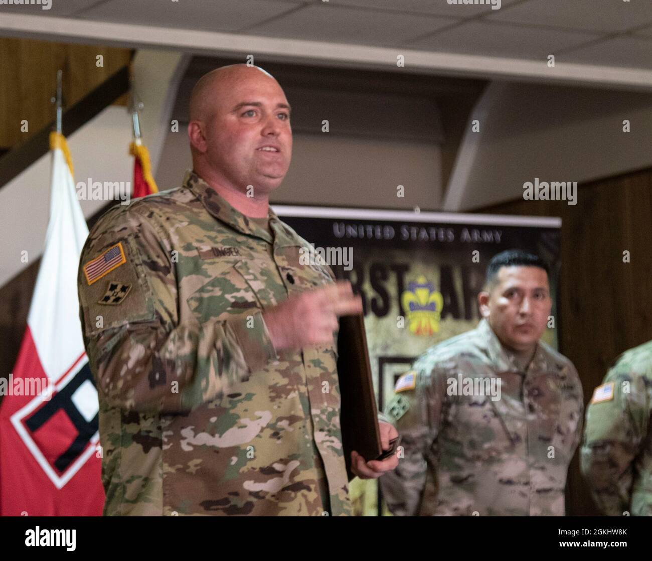U.S. Army Lt. Col. Curtis Unger, commander of 3rd Battalion, 351st Aviation  Regiment, 166th Aviation Brigade, Division West, gives his remarks after  receiving the Exceptional Organization Safety Award from Lt. Gen. Thomas