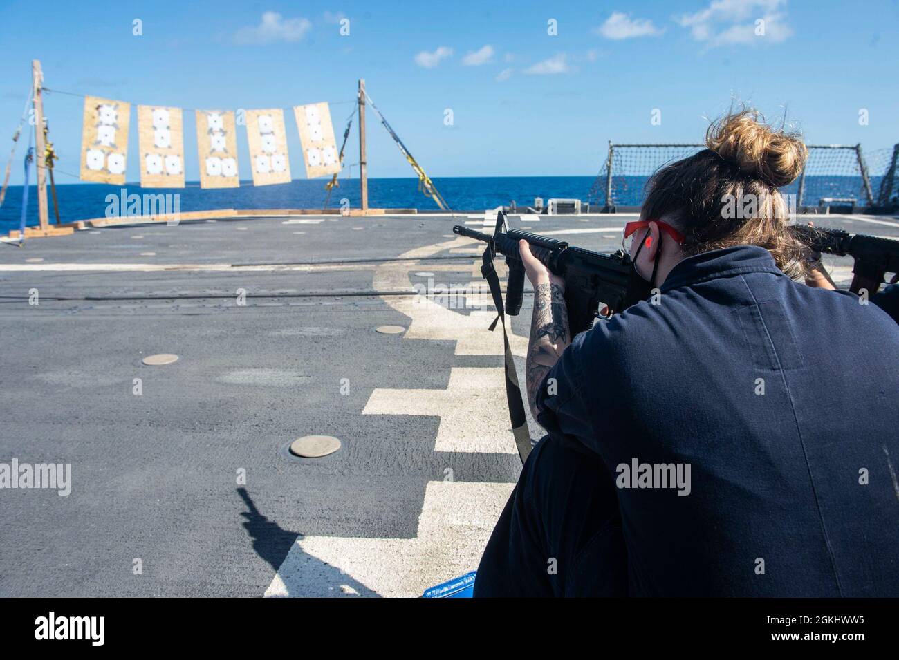 210427-N-RG587-1040 ATLANTIC OCEAN (April 27, 2021) Boatswain's Mate 3rd Class Rayna Woods, from Las Vegas, participates in a rifle qualification course aboard the Ticonderoga-class guided-missile cruiser USS Vella Gulf (CG 72), April 27, 2021. Vella Gulf is operating in the Atlantic Ocean in support of naval operations to maintain maritime stability and security in order to ensure access, deter aggression and defend U.S., allied and partner interests. Stock Photo