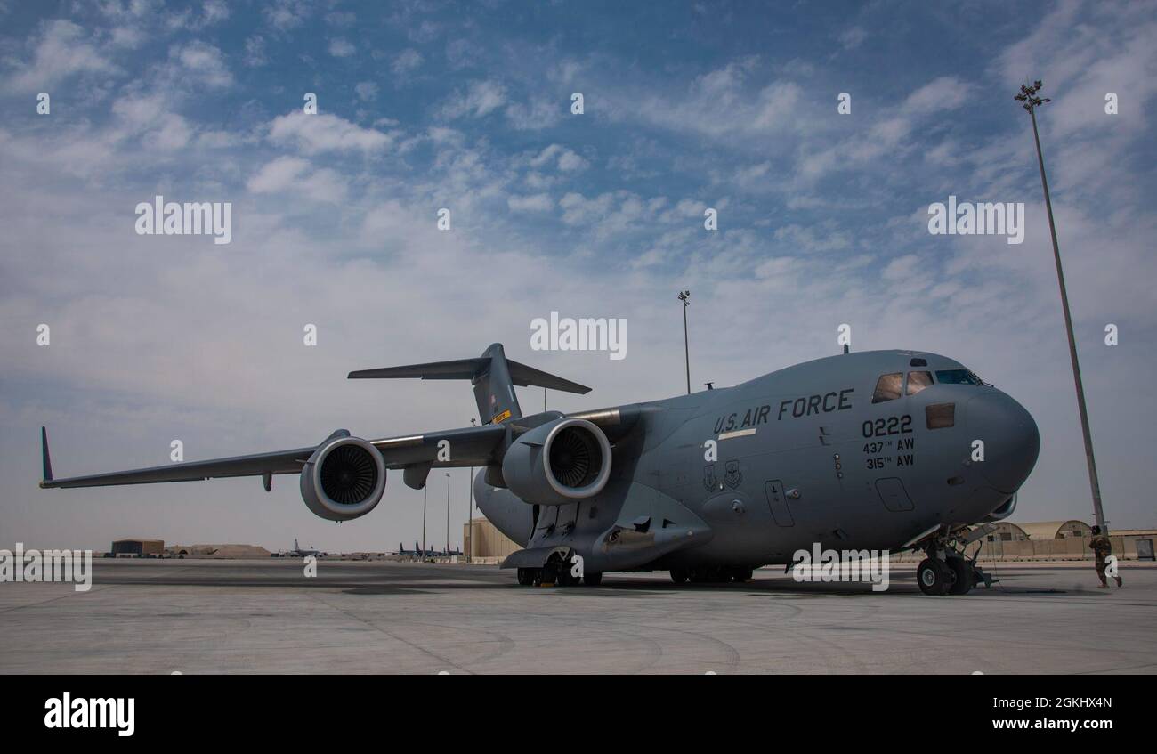 A C-17 Globemaster III assigned to Joint Base Charleston, South Carolina, parks on the flight line April 27, 2021, at Al Udeid Air Base, Qatar. U.S. Air Force C-17s and other mobility aircraft around the U.S. Air Forces Central theater are assisting with the safe and orderly drawdown operations from Afghanistan. Stock Photo