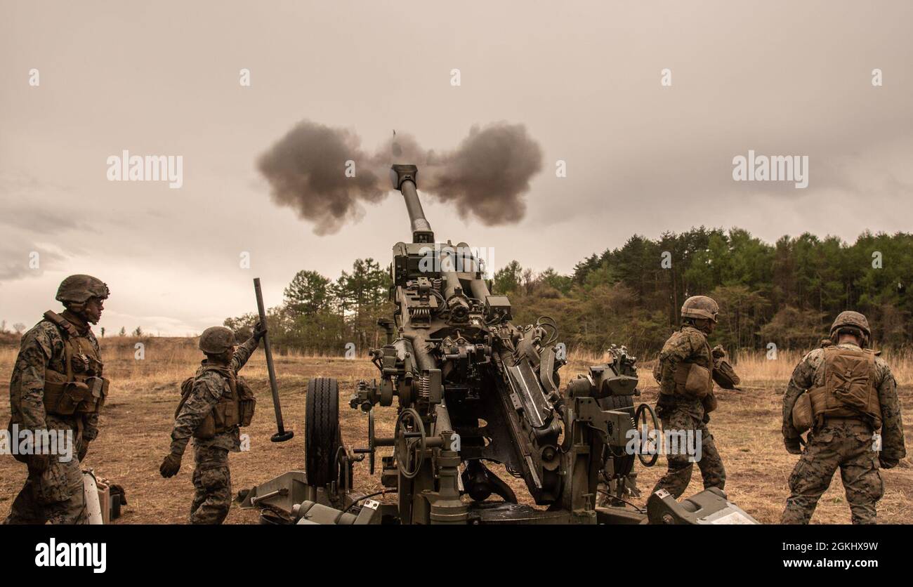 U.S. Marines with 3d Battalion, 12th Marine Regiment, 3d Marine Division, fire a M777A2 Howitzer during Artillery Relocation Training Program 21.1 at Combined Arms Training Center, Camp Fuji, Japan, April 28, 2021.  The training contributes to the defense of Japan and the U.S.-Japan Alliance as the cornerstone of peace and security in the Indo-Pacific region. ARTP provides realistic, live-fire training opportunities to the only permanently forward-deployed artillery unit in the Marine Corps, enabling them to provide precision indirect fires from a distributed environment in support of maritime Stock Photo