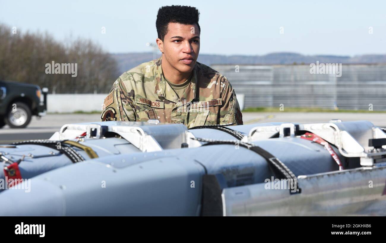 U.S. Air Force Staff Sgt. Winston Hendricks, 52nd Maintenance Squadron Precision Guided Munitions Crew Chief, assists with prepping a number of munitions for a U.S. Air Force F-16 Fighting Falcon during an exercise at Spangdahlem Air Base, Germany, April 27, 2021. In all, Airmen would load one AGM-158 Joint Air to Surface Standoff Missile and two ADM-160C Miniature Air Launched Decoy missiles. Stock Photo