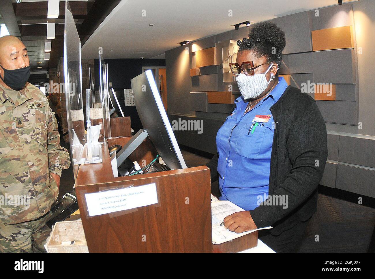 Holiday Inn Express employee Tylisha Hagood tends to a customer at the Fort  Lee Holiday Inn Express April 28. A front desk agent, Hagood said there a  lot to like about the