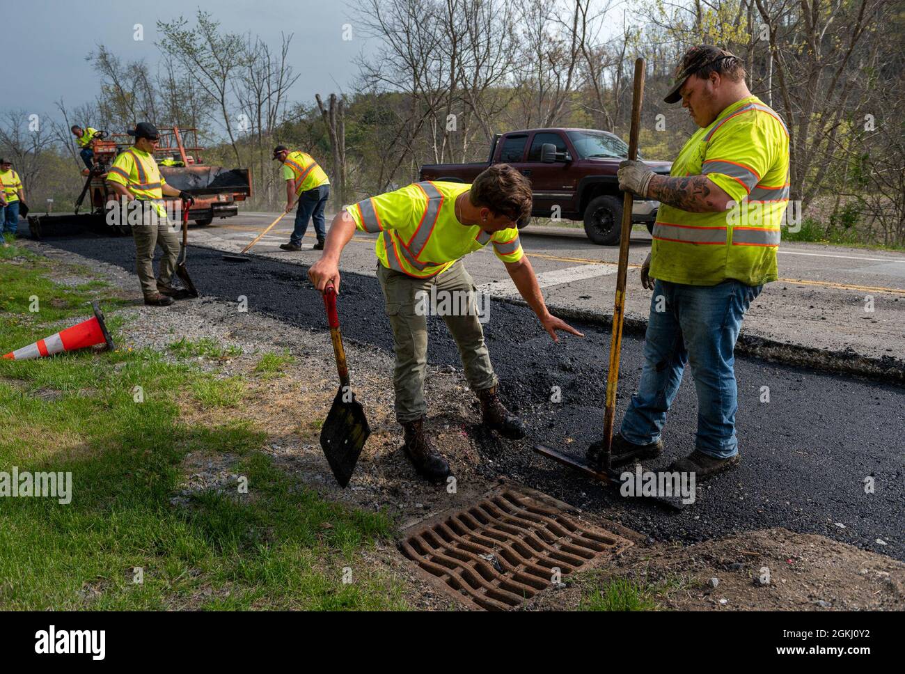 A construction crew repaves a road to cover newly completed sewer lines for a water infrastructure project partially funded under the Water Resource Development Act of 1936, in Amsterdam, Ohio, April 28, 2021. The U.S. Army Corps of Engineers Pittsburgh District oversees projects like this one, which helps distressed communities receive federal assistance under WRDA. The district has seen a growth in water and sewage infrastructure demand and approved nine new water projects in Allegheny County and Northern West Virginia in the last three years under Section 219. Eastern Ohio is covered by Sec Stock Photo