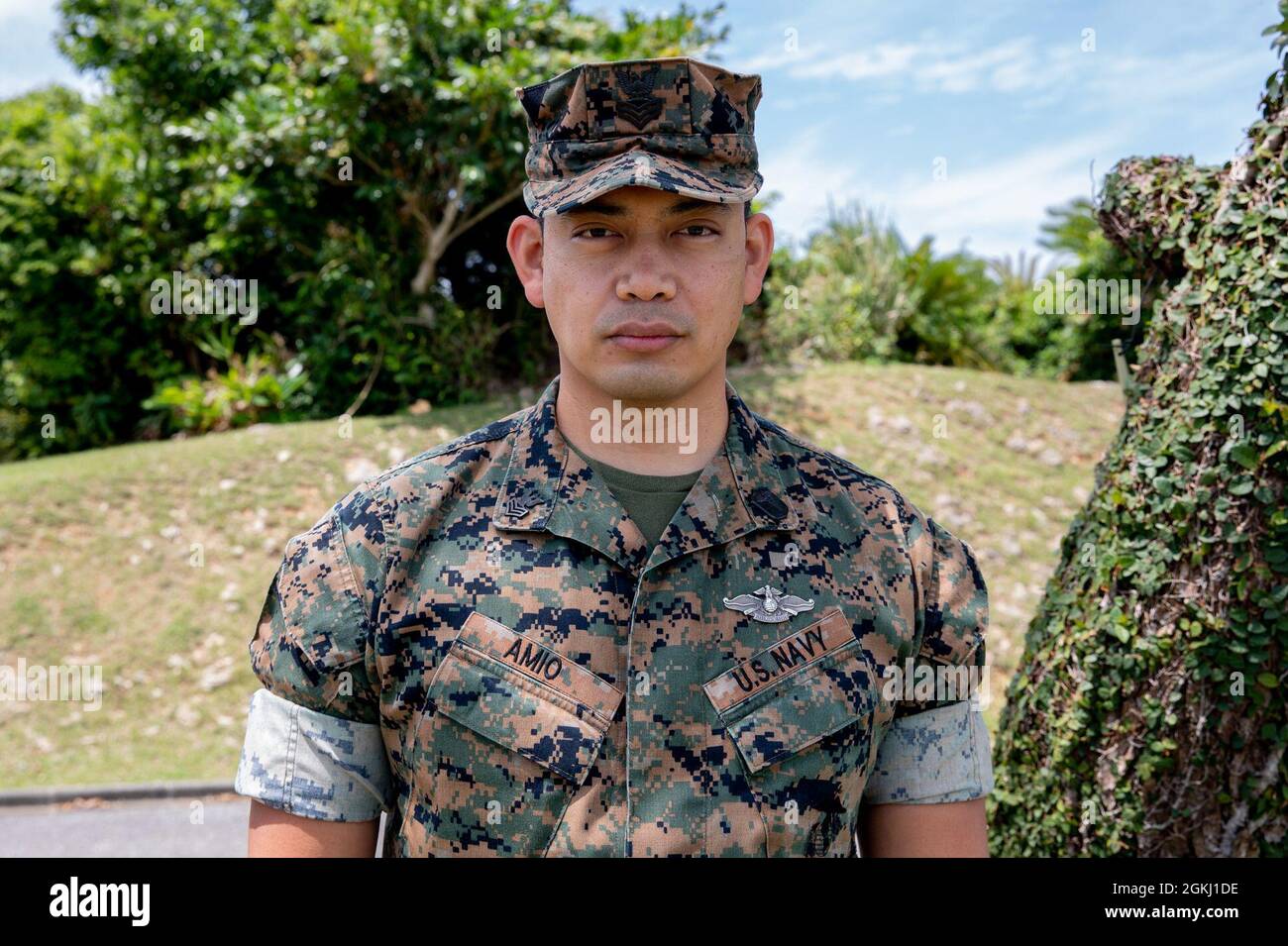 U.S. Navy Petty Officer 1st Class Juan P. Amio, a preventive medicine technician with 3rd Marine Expeditionary Brigade, poses for a photo on Camp Courtney, Okinawa, Japan, April 28, 2021.   “I’m originally from the Philippines. My family migrated in 1997 to Guam, and we were there for three years. From there my family migrated to Virginia Beach, and that’s where I was recruited. I joined a little later, at 21, because I figured I’d go to school first but found that school wasn’t for me. I had to find a better aspect of what I wanted to do with my life, and the Navy was it. I’ve been in the Nav Stock Photo