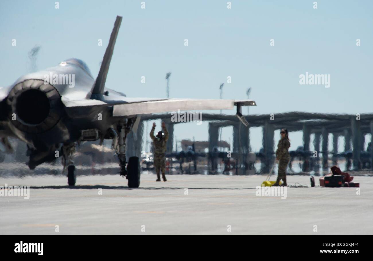 A U S Airman With Mountain Home Air Force Base Idaho Marshals An F 35 Lightning Ii To A Parking Spot During Exercise Rainier War At Mountain Home Afb April 29 21 During The
