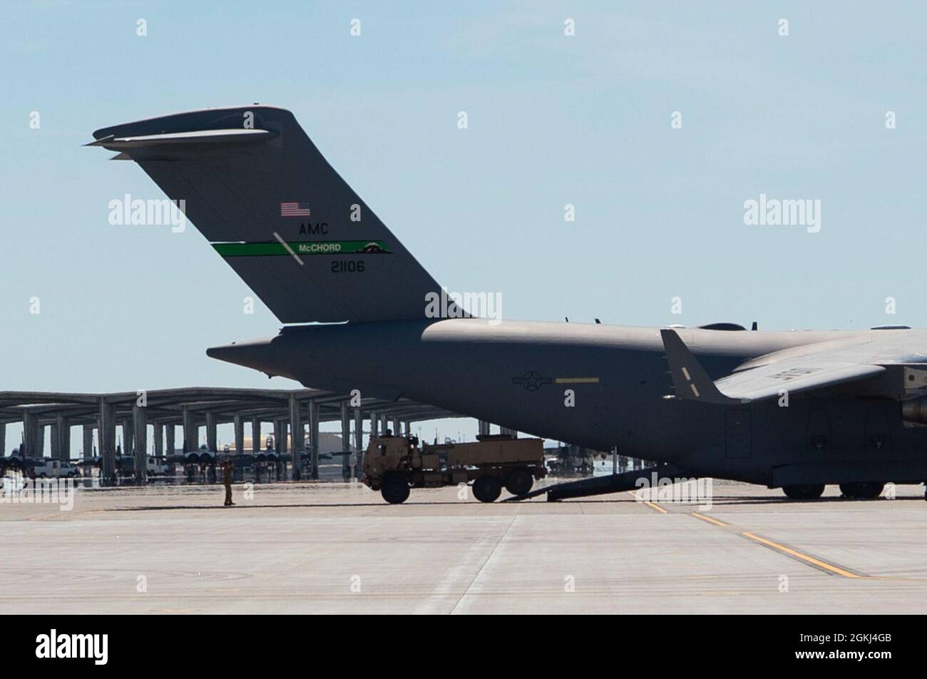 A U.S. Airman with Joint Base Lewis-McChord marshals a High Mobility ...