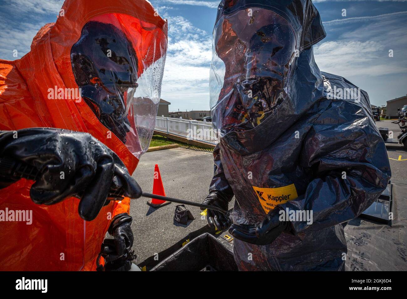 U.S. Army Staff Sgt. Mauricio Caceres, left, decontaminates Sgt. Quran T. Williams, both survey team members with the  21st Weapons of Mass Destruction-Civil Support Team (21st WMD-CST), New Jersey National Guard, during an Army North mandated training proficiency evaluation at the Bethany Beach Training Site, Bethany Beach, Del., April 29, 2021. The 21st WMD-CST supports civil authorities at man-made or natural disasters by identifying chemical, biological, radiological, and nuclear substances, assess the consequences, and advises on response measures. Stock Photo