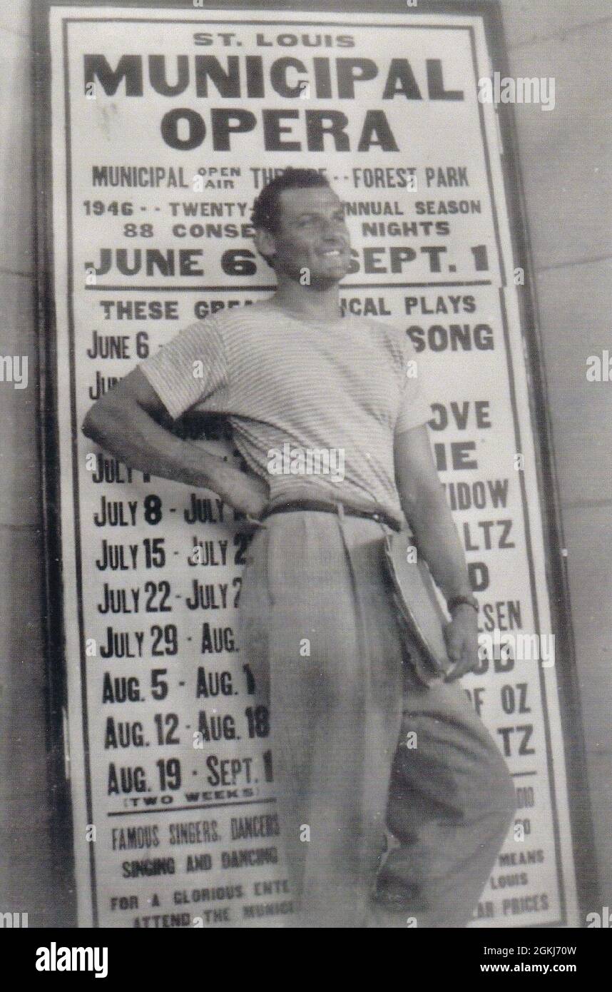 Opera singer stands in front of St. Louis Municipal Opera schedule for June 1946 - vintage black and white stock photo Stock Photo