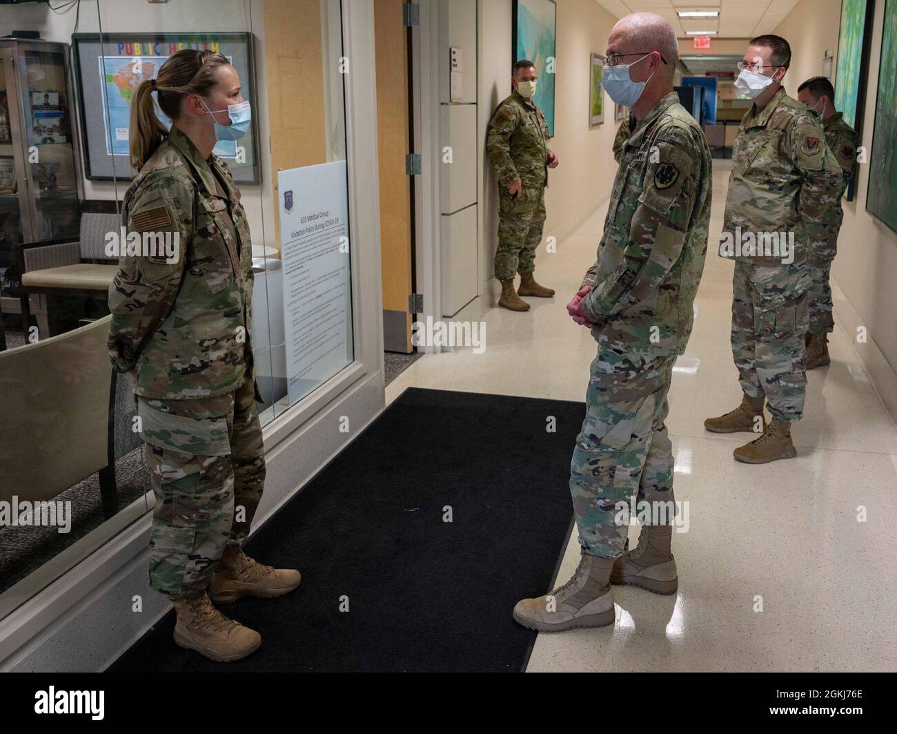 U.S. Air Force Tech. Sgt. Candace Kime, 633rd Medical Group community health section chief, briefs U.S. Army Lt. Gen. Ronald Place, Defense Health Agency director, during a visit to Joint Base Langley-Eustis, Virginia, April 29, 2020. Kime briefed on contact tracing operations during the COVID-19 pandemic. Stock Photo