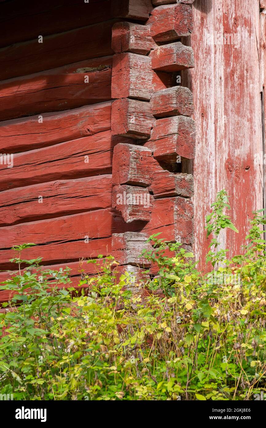 Helsinki / Finland - SEPTEMBER 2, 2021: Close-up detail of an old red log house Stock Photo