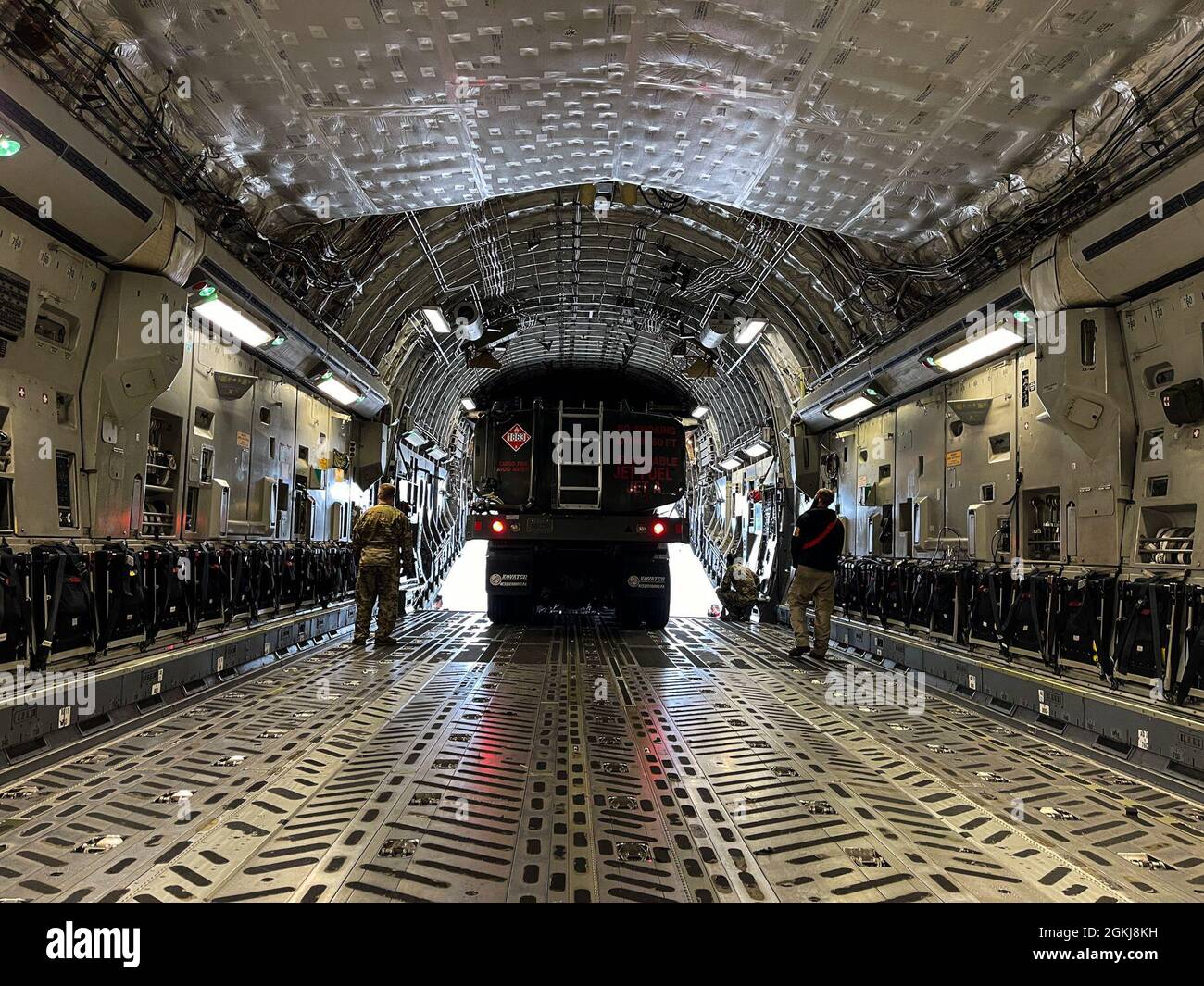 U.S. Air Force Airmen with the 62nd Airlift Wing unload an R-11 ...