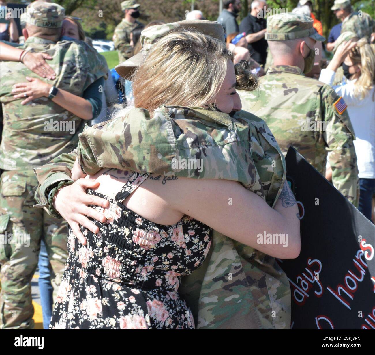 Chelsea Stengel hugs Staff Sgt. Dayna Brown after waiting for more than 11 months. About 165 Illinois Army National Guard Soldiers returned April 30 to Illinois after an 11-month deployment to Ukraine where the unit formed “Task Force Illini” as the command element of Joint Multinational Training Group-Ukraine, which is responsible for training, advising and mentoring the Ukrainian cadre at Combat Training Center-Yavoriv, Ukraine to improve Ukraine’s training capacity and defense capabilities. Headquarters Headquarters Company of the 33rd Infantry Brigade Combat Team flew into Willard Airport Stock Photo