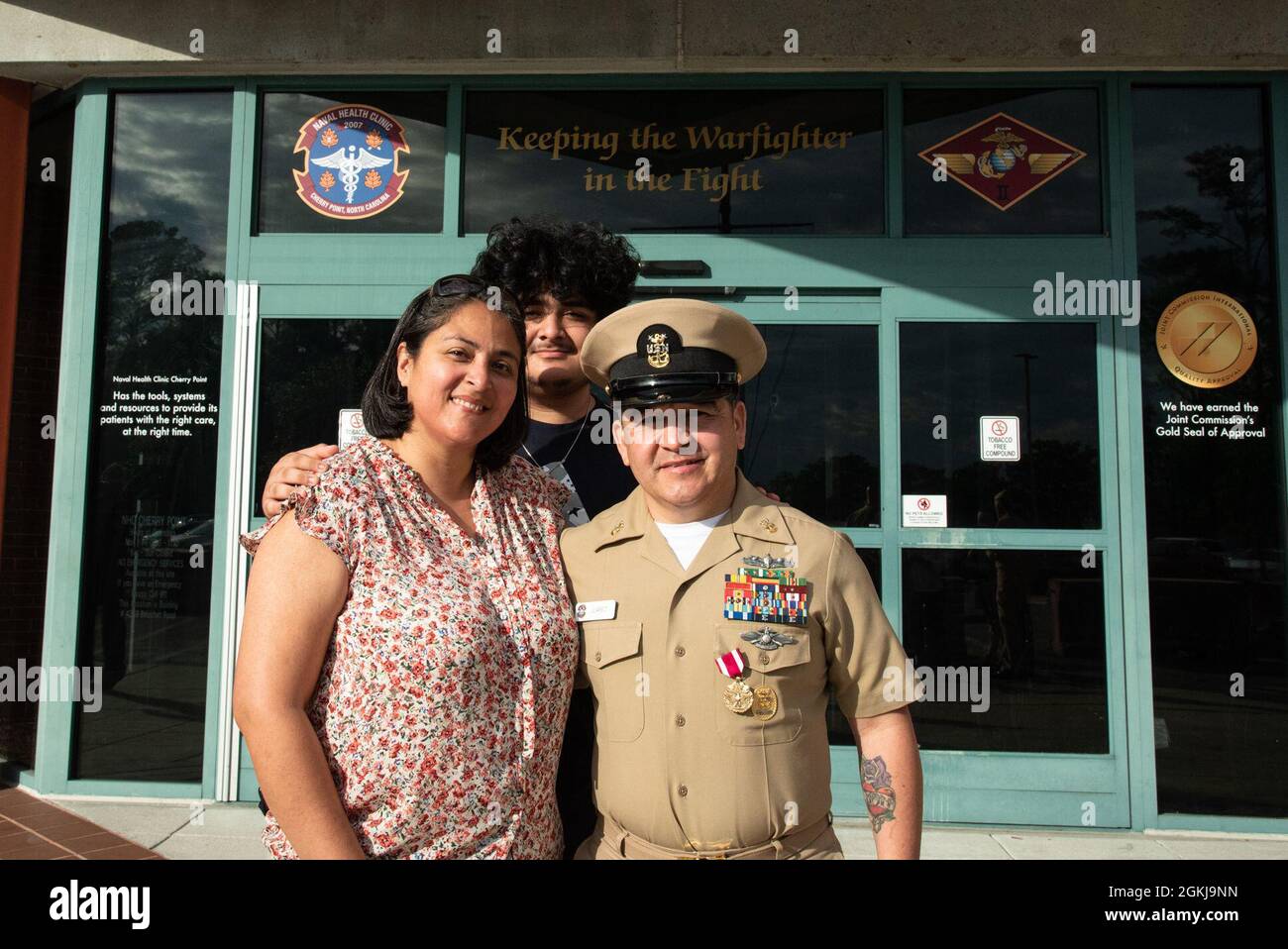 Jason R Juarez Command Master Chief Jason Juarez, right, stands with his family ...