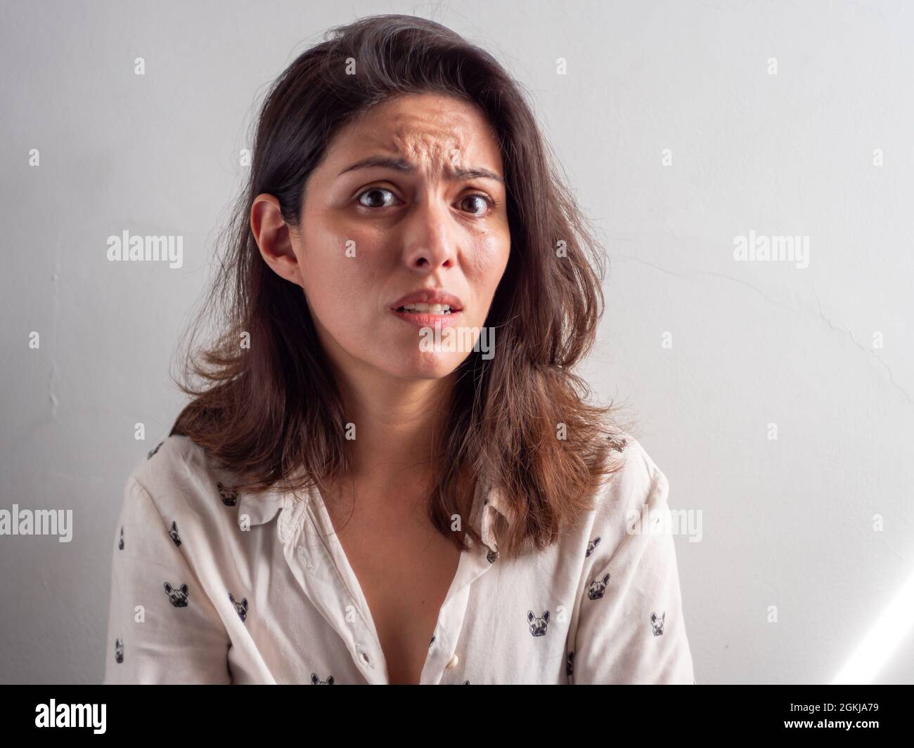 Young Handsome Brown Hair Peruvian Woman Looks Stressed and Affraid Stock Photo