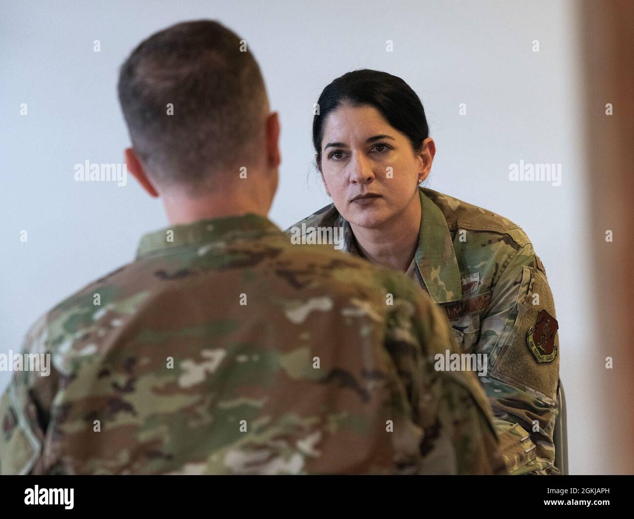 Washington Air National Guard Lt. Col. Lita Rakhra (right) listens to feedback from a fellow WA ANG Headquarters colleague during a ‘Speed Mentoring’ training session held at the Washington National Guard Museum, Camp Murray, Wash., April 30, 2021. During a 4-day extended Regularly Scheduled Drill (RSD) weekend, April 29 – May 2, Headquarters members took part in several activities designed to enhance unit cohesiveness, while blending personal and professional understandings in the work place. Stock Photo