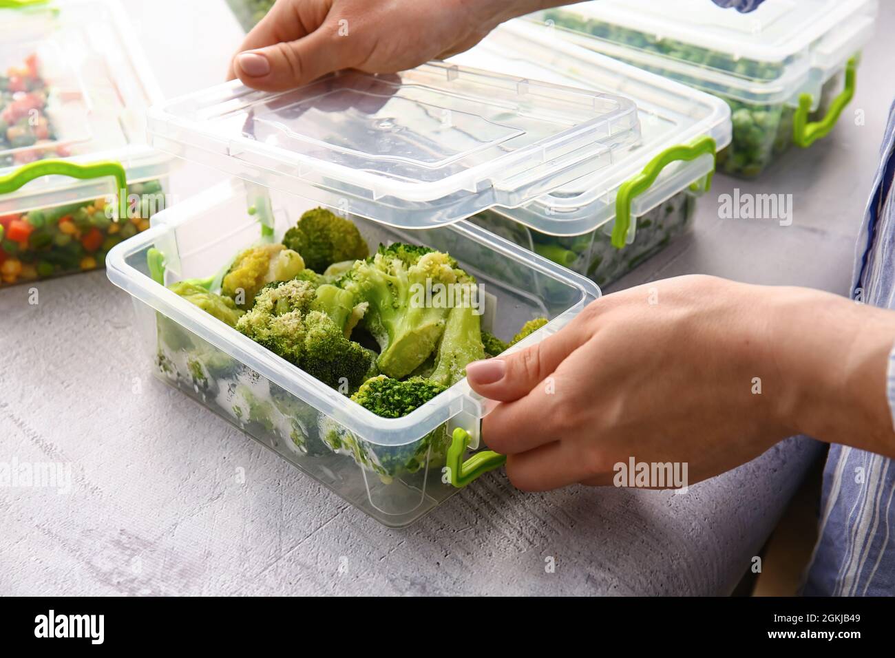 Container Closing Food Woman closing plastic containers hi-res stock photography and images ...
