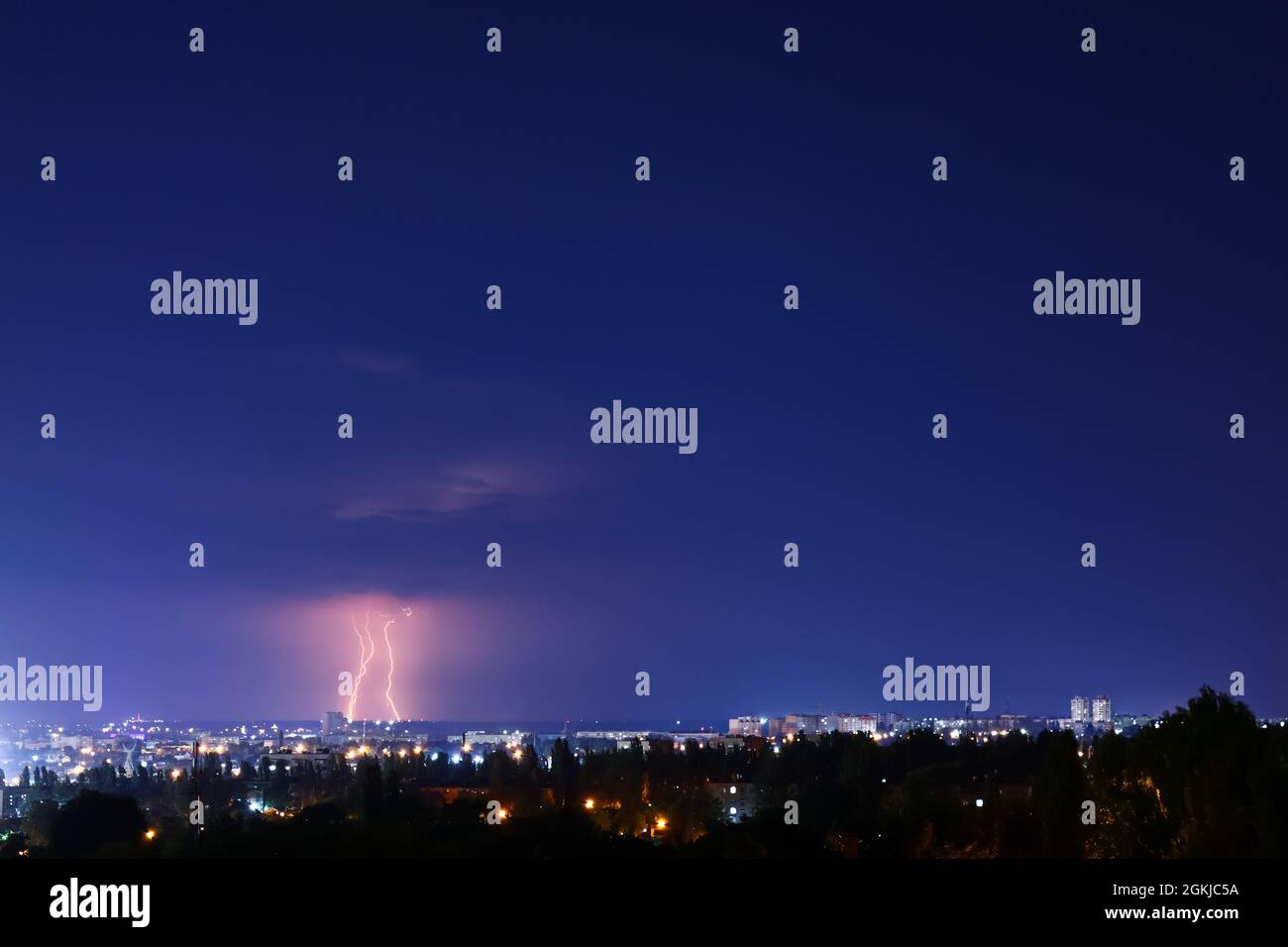 Dark sky with lightning over night city Stock Photo - Alamy