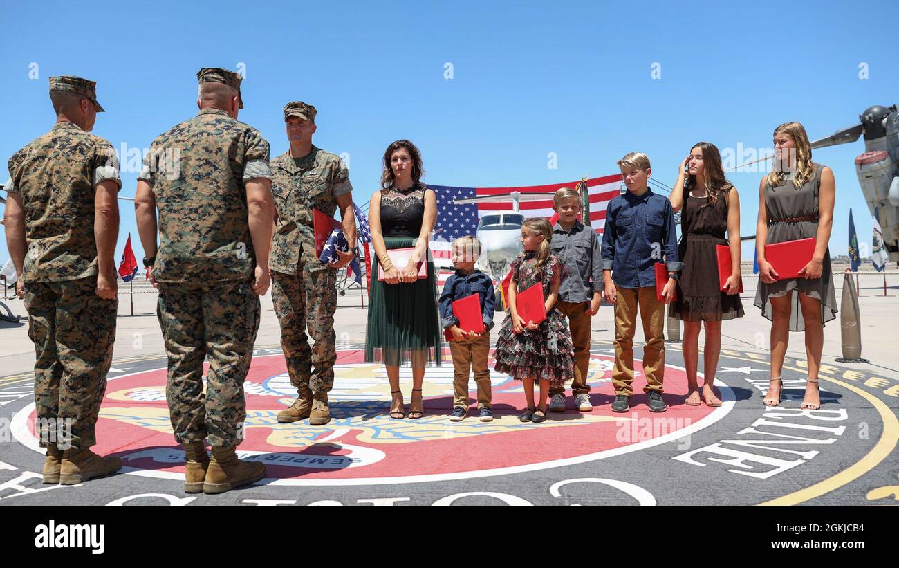 Lt. Col. Jim Paxton stands with his family during a retirement ceremony at  Marine Corps Air Station Yuma, April 30, 2021. The ceremony honored LtCol Paxton and the sacrifice he made while serving in the Marine Corps. Stock Photo