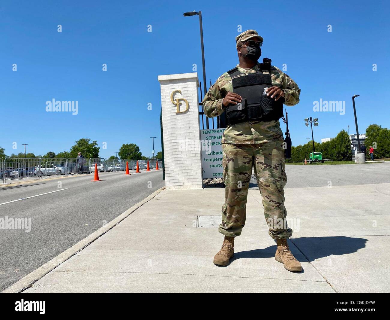 Sgt. David Hollowell with the 1792nd Combat Sustainment Support Battalion stands guard at a traffic entry point at Churchill Downs in Louisville, Ky., May 1, 2021. Nearly 100 Kentucky National Guard Soldiers and Airmen supported local authorities during the 147th running of the Kentucky Derby. Stock Photo