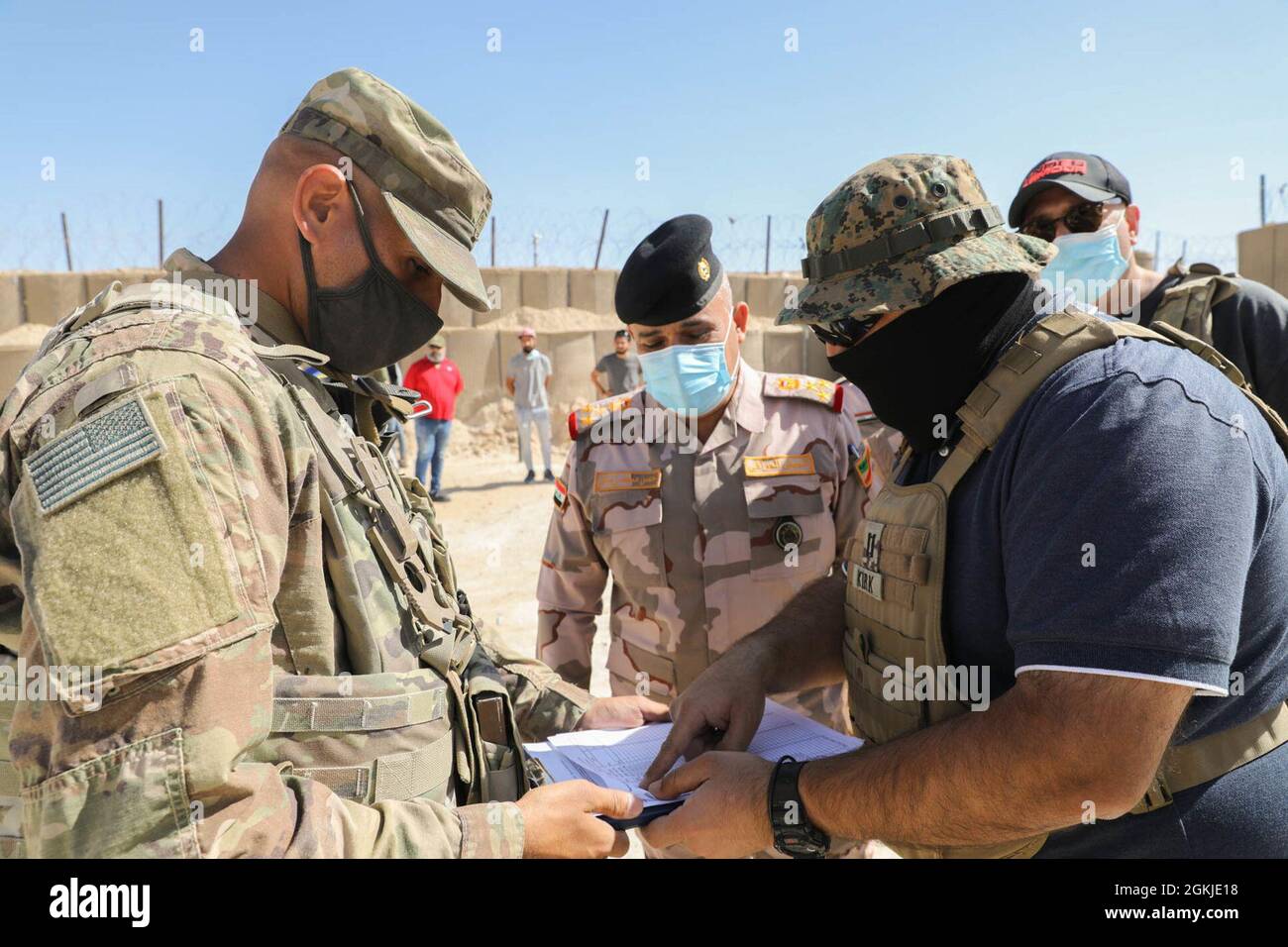 U.S. Army Officer 2LT Rudolph DaRocha reviews the inventory with Ministry of Defense 1st Division Commander BG Hassan Mohamed Zidan Khalaf AL-KARWI. Counter-ISIS Train and Equip Fund program provides vehicles to Iraqi partner forces valued at $9,519,740.00 of 36 M1151A1's and 20 Land Cruisers at Al Asad Air Base on May 1, 2021. The U.S. CTEF program supports Iraqi partner forces with equipment to enhance their fight against hostile D'aesh forces. Stock Photo