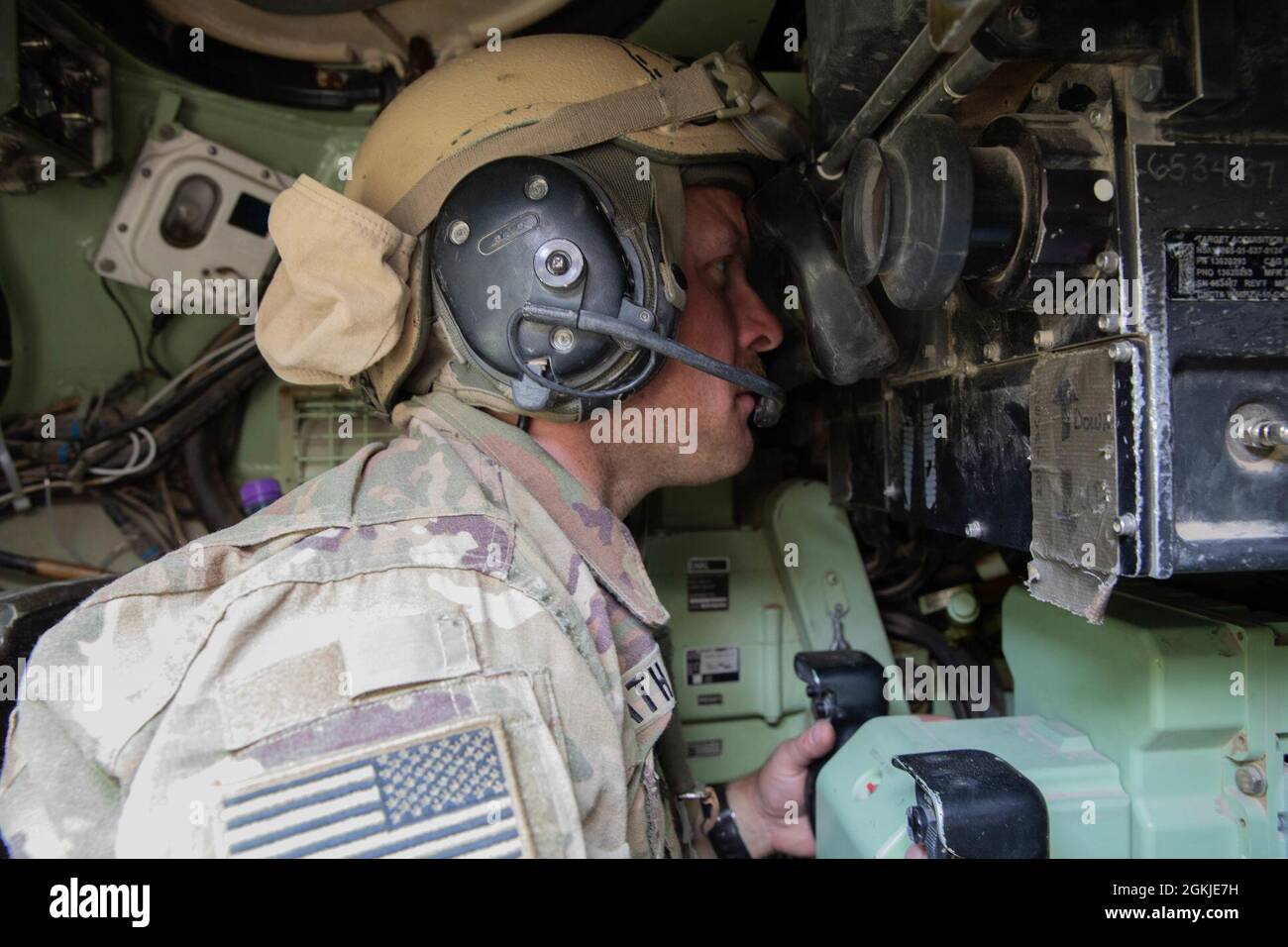 Sgt. Michael Vath, commander's gunner, 1st Battalion, 194th Armor Regiment,1st Brigade Combat Team, 34th Infantry Division looks into the Bradley Fighting Vehicles sight to aim at his target Udairi Range, Kuwait, May 2m 2021. There are three different targets at 600 meters, 1100 meters and 1400 meters. Stock Photo