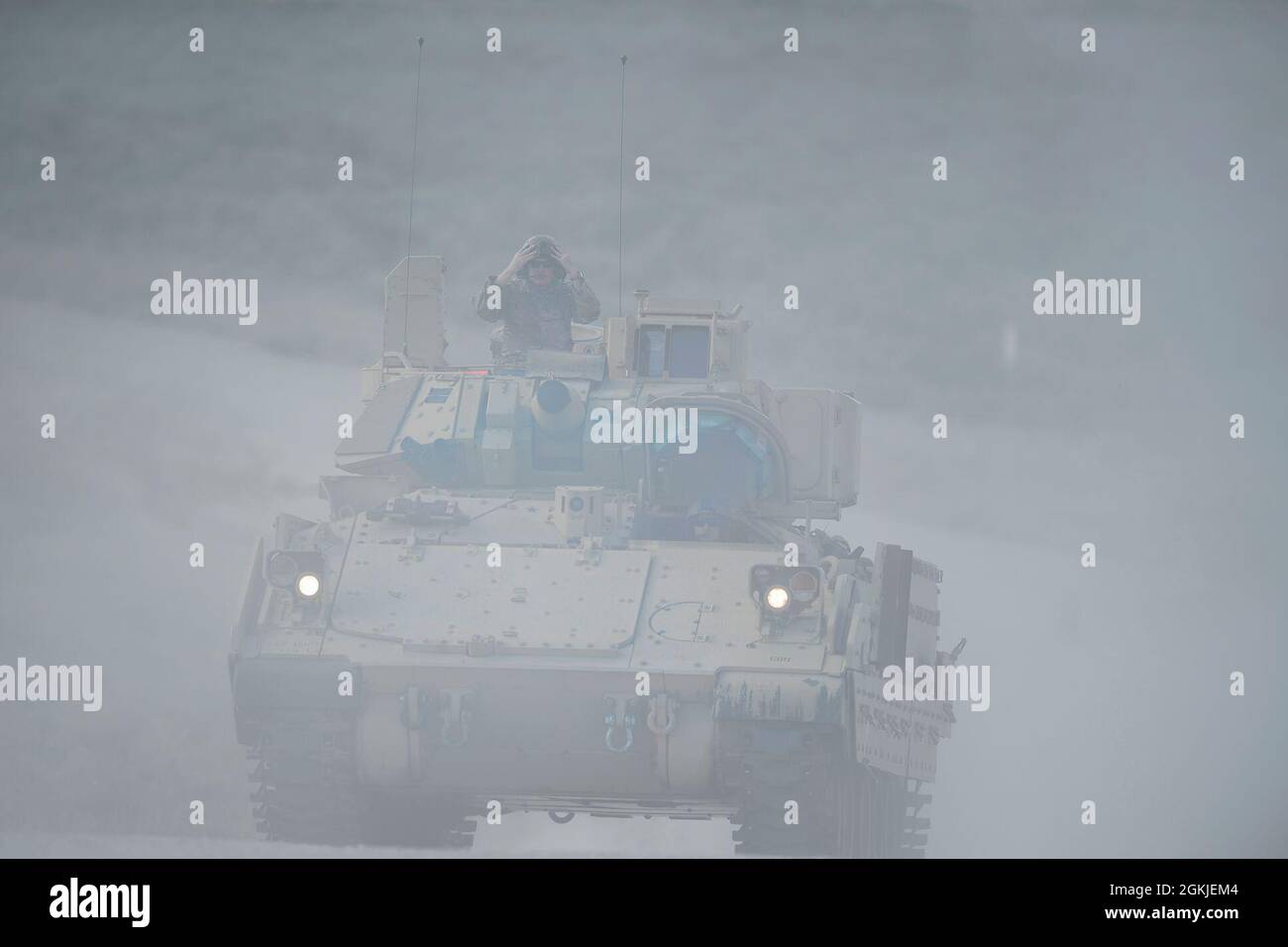 A Bradley Fighting Vehicle with Charlie Company of the 2-116th Combined Arms Battalion drives on through the dust toward the firing range on the first day out into the Orchard Combat Training Center. On the first day of annual training a spring storm blew through the OCTC as the 2-116th was preparing their vehicles and organizing their movement. Steady winds were recorded at over 30 miles per hour with frequent gusts over 50 mph.    The Visual Information Office for the Idaho Army National Guard will begin posting a series of images this week that document the variety training and units from t Stock Photo