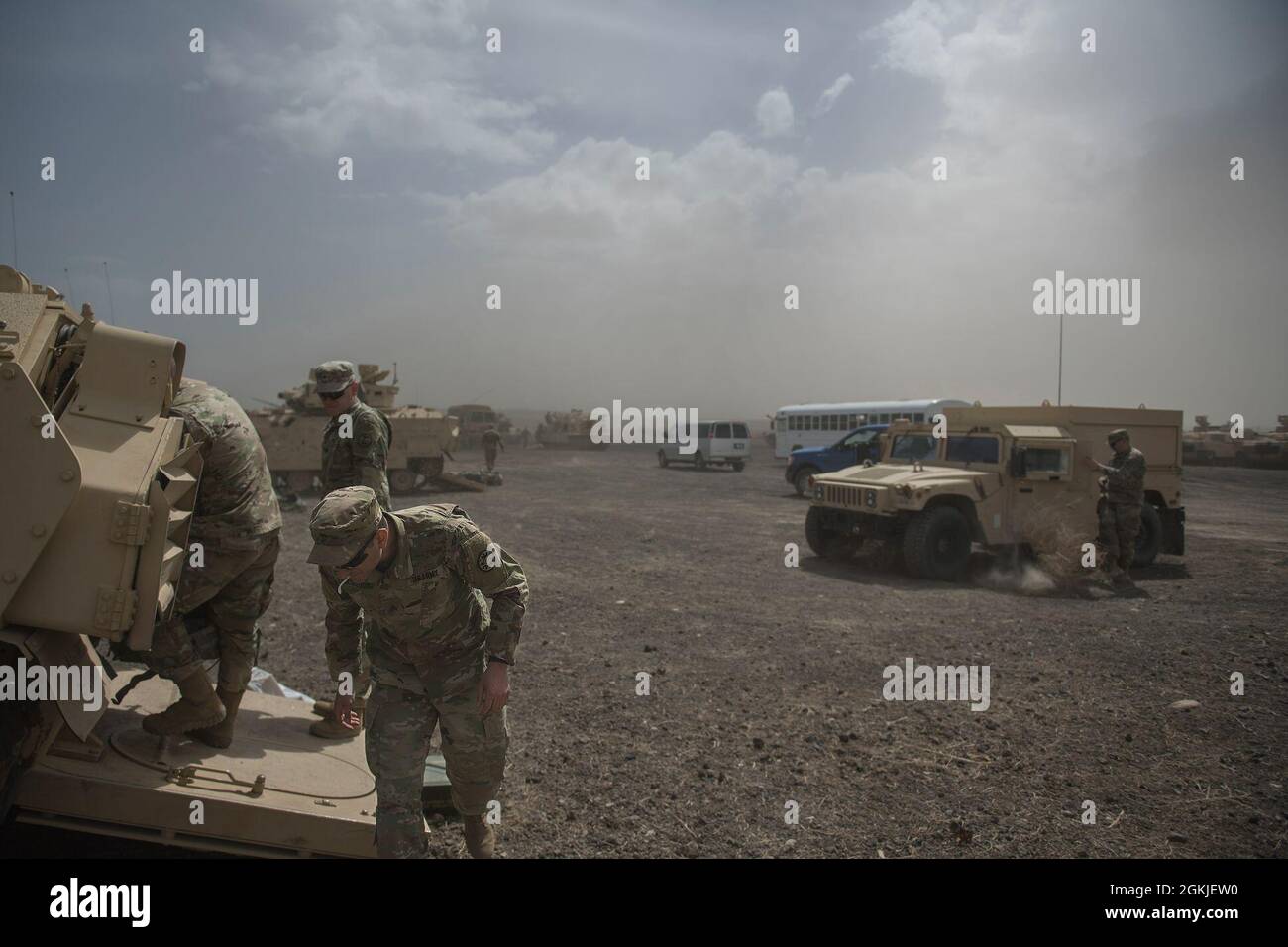 During Charlie Company’s afternoon preparations, a sudden storm blew in across the desert and enveloped the soldiers and equipment in the compound. A sand storm sent soldiers running for cover and hurriedly dragging equipment and belongings into tracked vehicles for protection. Winds were clocked at over 30 mph with frequent gusts as high as 55 mph.    Charlie Company from the 116th Cavalry Brigade Combat Team began annual training on the morning of May 1, 2021 and returned from the Orchard Combat Training Center on the evening of May 13.  The men and women of C Company completed a successful Stock Photo