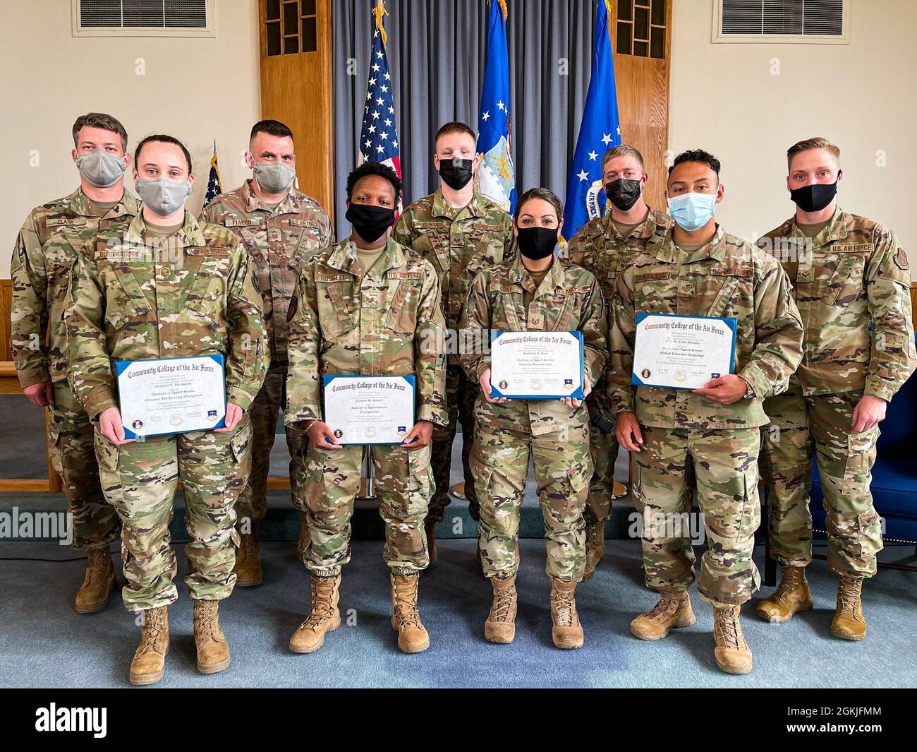 Nine airmen from the 914th Air Refueling Wing at Niagara Falls Air Reserve Station, New York pose for a group photo after being presented their diplomas from the Community College of the Air Force on May 2, 2021. The CCAF degree is meant to complement their respective career field and meant to help them learn and grow professionally. Stock Photo