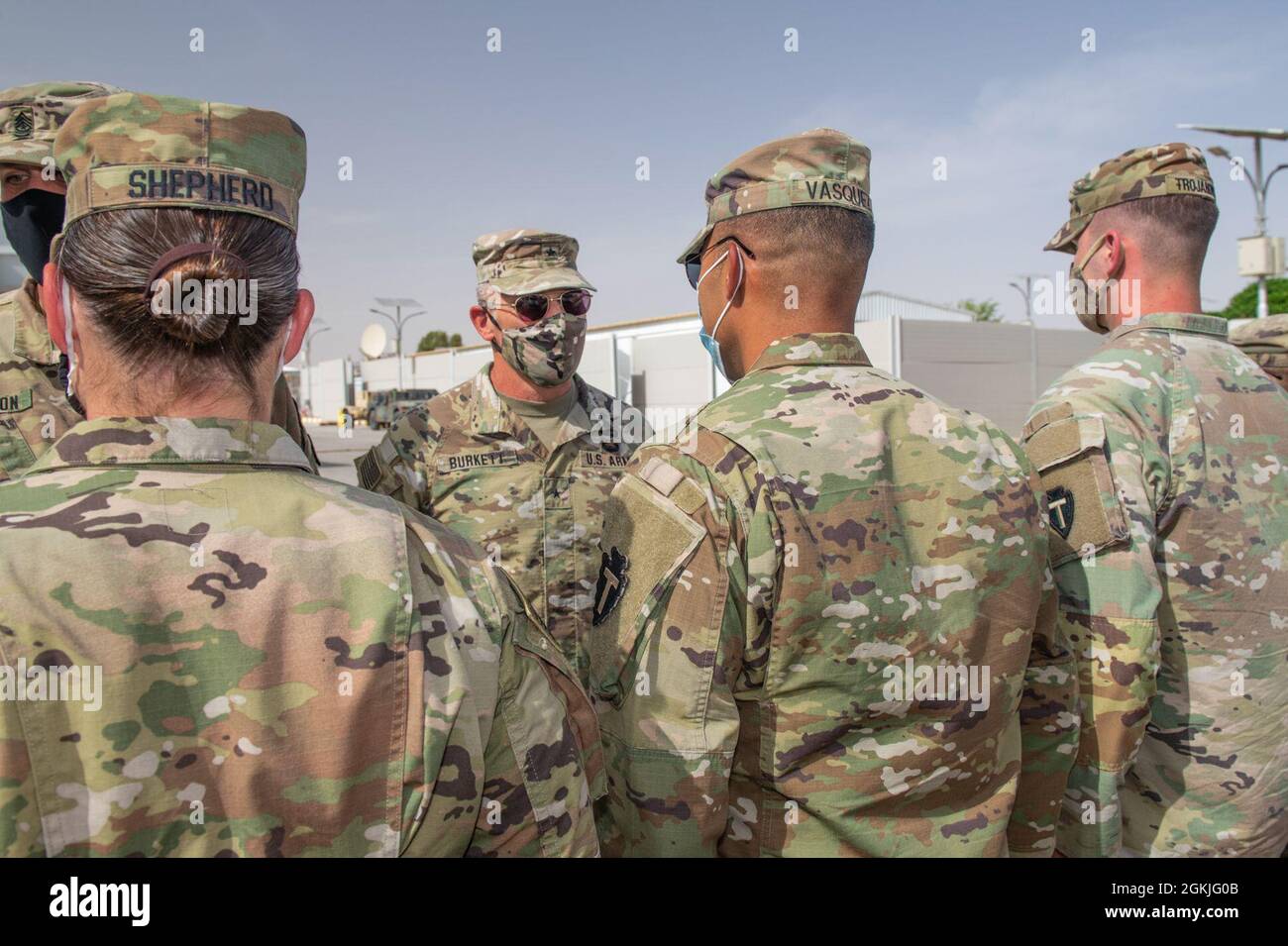 U.S. Army Soldiers from Task Force Spartan receive their right sleeve insignia, T-Patch, during a ceremony hosted by the Division Tactical-Jordan Officer in Charge, Col. Christopher Fletcher and Sgt. Maj. Daniel Johnson for Division Tactical, at the Joint Training Center, May 3, 2021. Brig. Gen. Win Burkett, Task Force Spartan Assistant Commanding General- Operations congratulated the Soldiers on their special day becoming a part of the 36th Infantry Division's history. Stock Photo