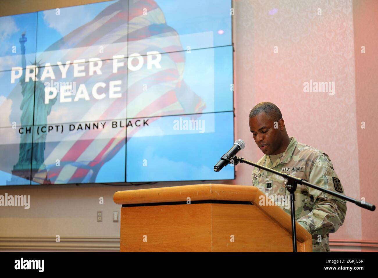 Chaplain (Capt.) Danny Black, chaplain for the 311th Military Intelligence Battalion, prays for peace during the National Day of Prayer Lunch at the Camp Zama Community Club, Camp Zama, Japan, May 3. Stock Photo