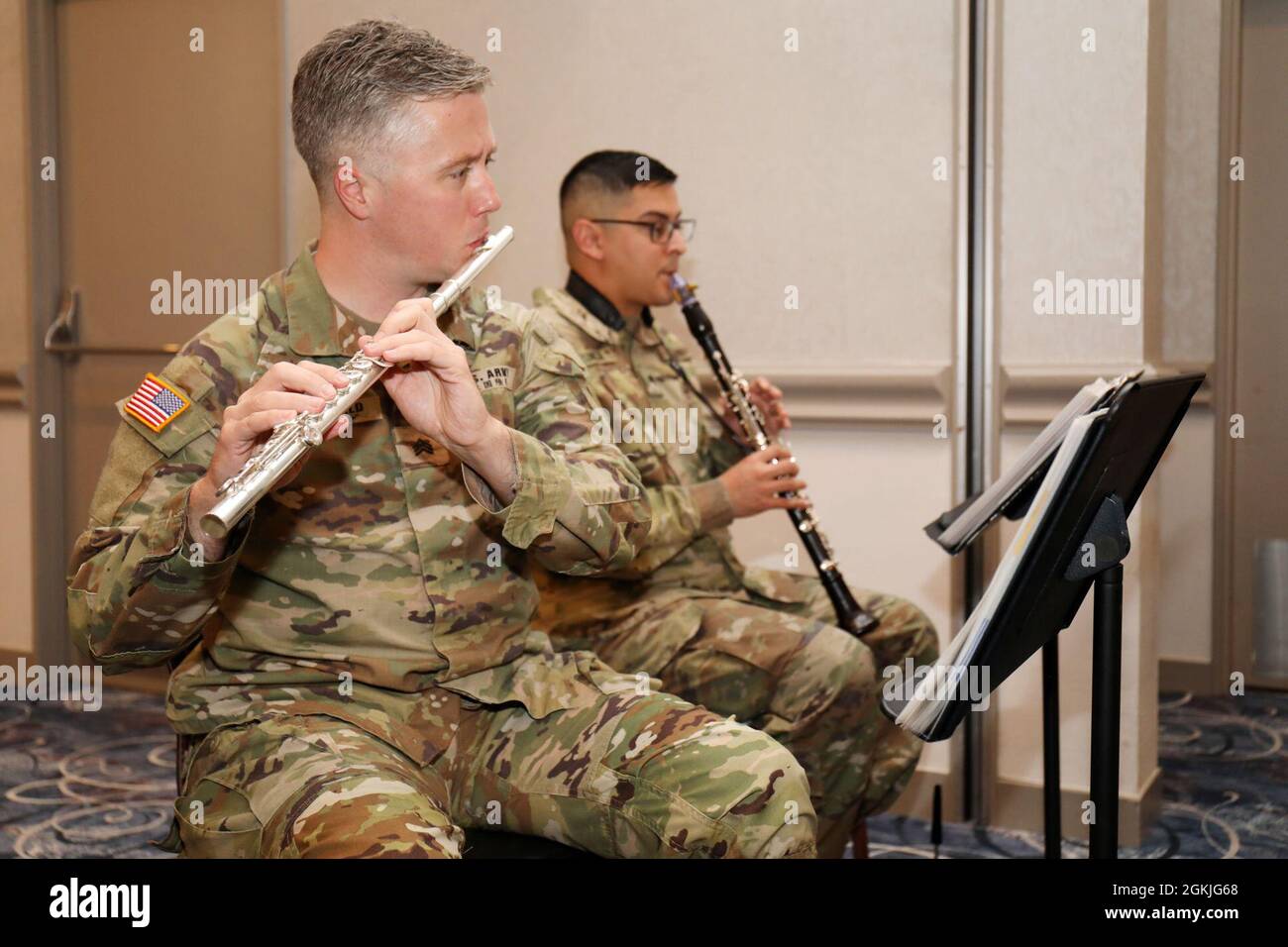 Sgt. Ryan MacDonald and Spc. Michael Zuniga, members of the U.S. Army Japan Band’s Fuji Winds woodwind quintet, play during the National Day of Prayer Lunch at the Camp Zama Community Club, Camp Zama, Japan, May 3. Stock Photo