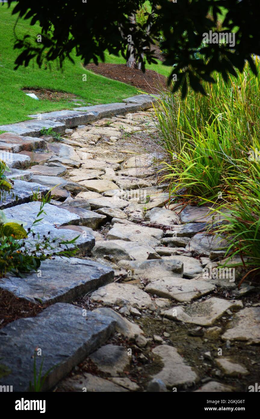 A dry creek bed in a park Stock Photo Alamy