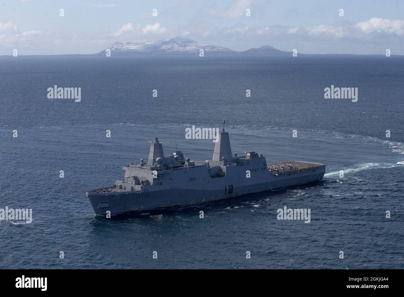 210503-M-JX780-1563 GULF OF ALASKA (May 3, 2021) – The amphibious transport dock ship USS Somerset (LPD 25) maneuvers through the Gulf of Alaska in support of Northern Edge 2021. U.S. service members are participating in a joint training exercise hosted by U.S. Pacific Air Forces May 3-14, 2021, on and above the Joint Pacific Alaska Range Complex, the Gulf of Alaska, and temporary maritime activities area. NE21 is one in a series of U.S. Indo-Pacific Command exercises designed to sharpen the joint forces’ skills; to practice tactics, techniques, and procedures; to improve command, control and Stock Photo