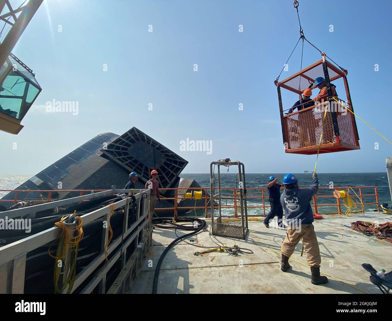 Contracted salvage divers are transported from the SEACOR Eagle to the SEACOR Power, May 3, 2021 off Port Fourchon, Louisiana. Operations have commenced to remove the fuel from SEACOR Power. Stock Photo