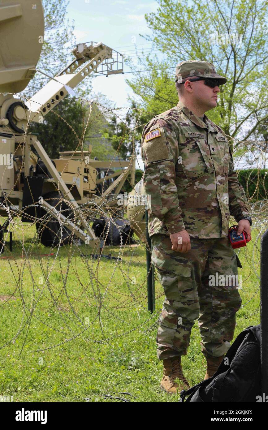 U.S. Army Spc. Michael Mcclure assigned to HHC 50th ESB(E) prepares to test equipment during the joint, multinational airborne operation Swift Response at Mihail Kogalniceanu Air Base, Romania, May 5, 2021. Swift Response 21 is the first exercise of the larger operation Defender Europe 21 during which U.S. forces work closely together with NATO allies and partners. Stock Photo