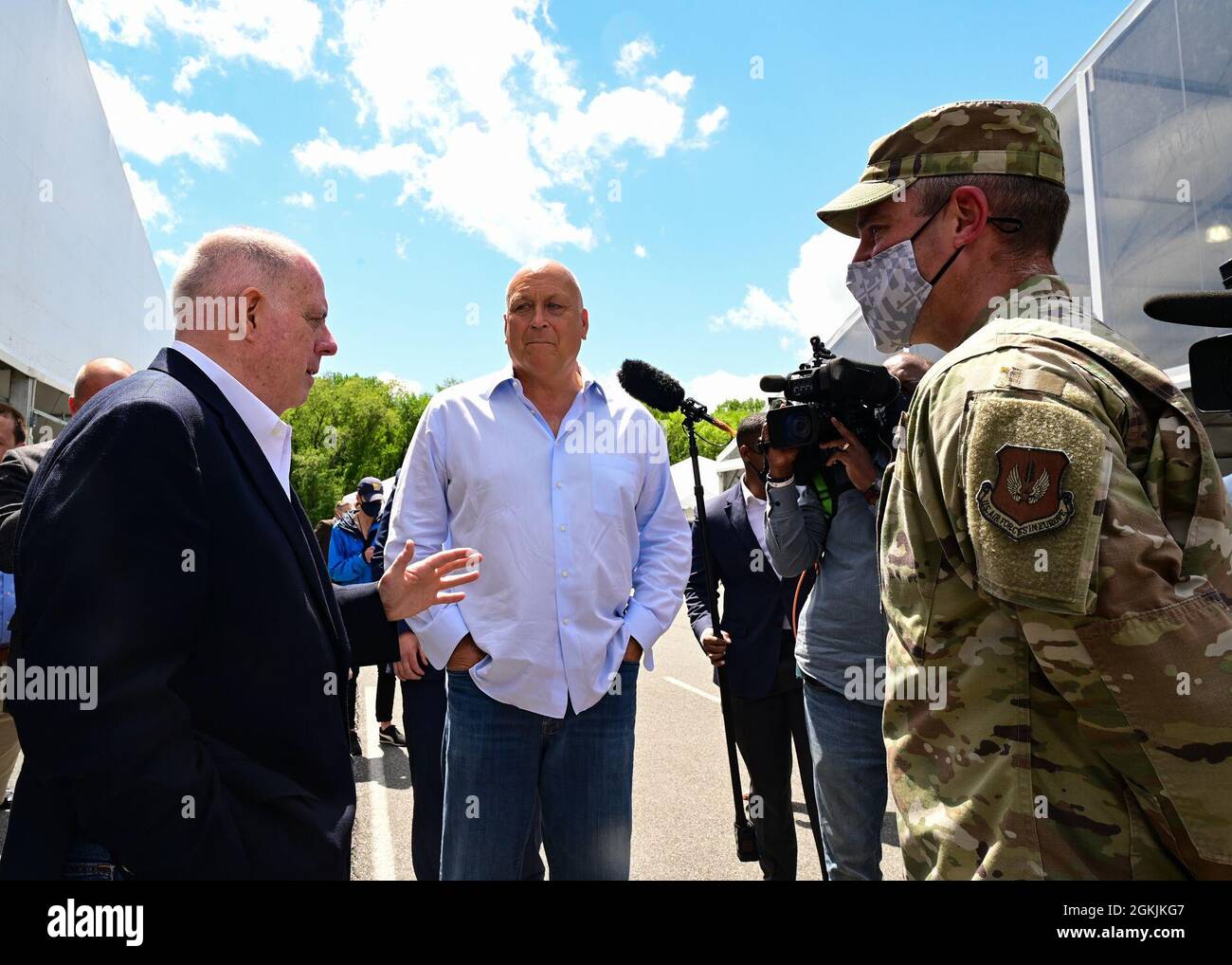 Maryland Governor Larry Hogan, Cal Ripken Jr. and U.S. Air Force Maj. John Fink, Maryland Air National Guard, speak during a visit to the Ripken Stadium vaccination site on May 5, 2021, in Aberdeen, Maryland. Fink has supported planning and setup numerous mass vaccination sites throughout the state. Stock Photo