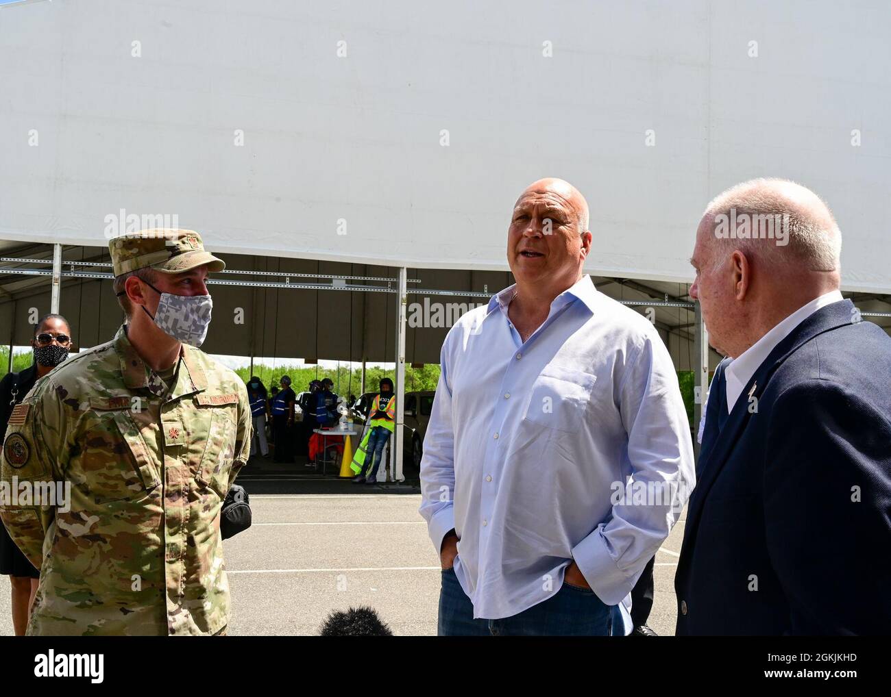 U.S. Air Force Maj. John Fink, Maryland Air National Guard, speaks with Cal Ripken Jr. and Maryland Governor Larry Hogan during a visit to the Ripken Stadium vaccination site on May 5, 2021, in Aberdeen, Maryland. Fink has supported the planning and setup of numerous mass vaccination sites throughout the state. Stock Photo