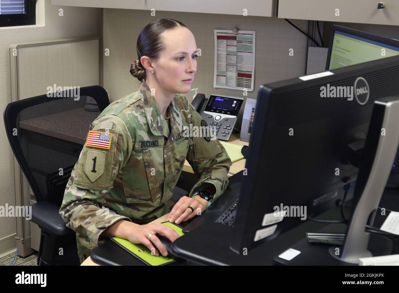 Maj. Kathryn Buckland, the chief of the resource management division for Weed Army Community Hospital responds to emails May 5 at the Dr. Mary E. Walker Center on Fort Irwin, Calif. Buckland, a Leesburg, Va., native, became a fellow of the American College for Healthcare Executives in March 2021. Stock Photo