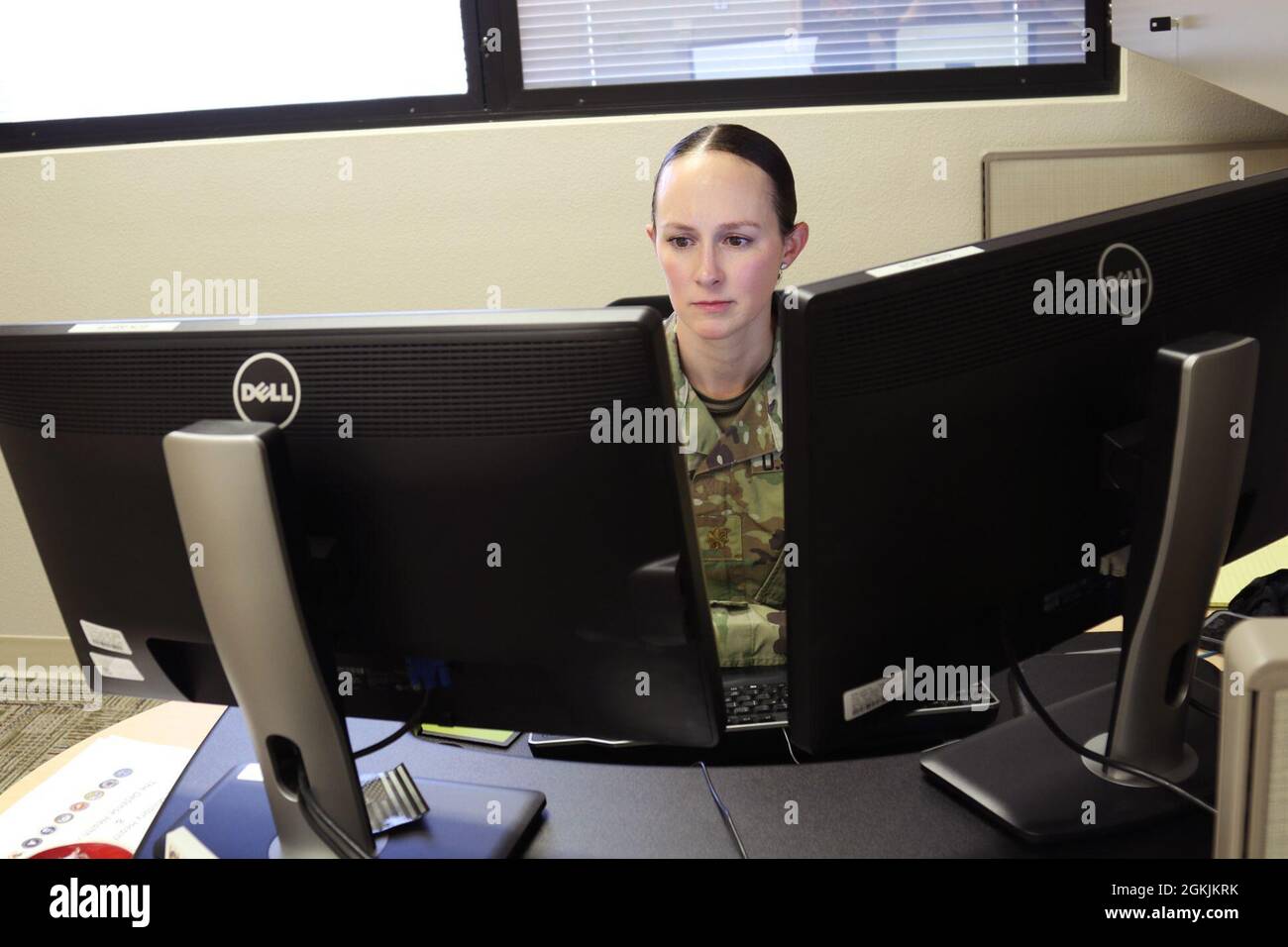 Maj. Kathryn Buckland, the chief of the resource management division for Weed Army Community Hospital responds to emails May 5 at the Dr. Mary E. Walker Center on Fort Irwin, Calif. Buckland, a Leesburg, Va., native, became a fellow of the American College for Healthcare Executives in March 2021. Stock Photo