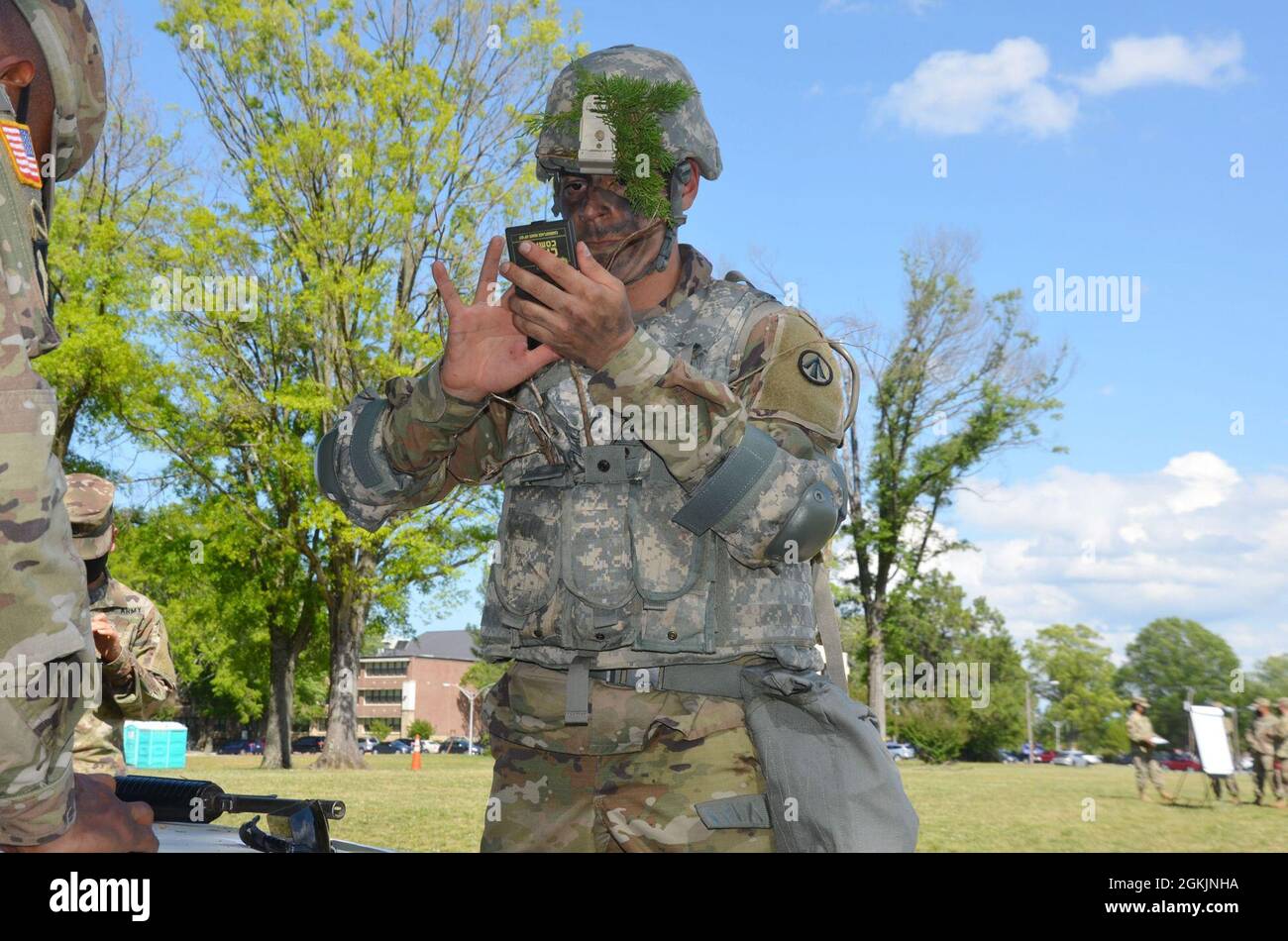 Pfc. Victor Vasquez, a cargo specialist from Juarez, Mexico, 689th Rapid Port Opening Element, 832nd Transportation Bn., 597th Transportation Bde. applies camouflage at Joint Base Langley-Eustis, Va. May 5, 2021.    Vasquez was representing the 597th Transportation Bde. during the 2021 Military Surface Deployment and Distribution Command Best Warrior Competition. Stock Photo