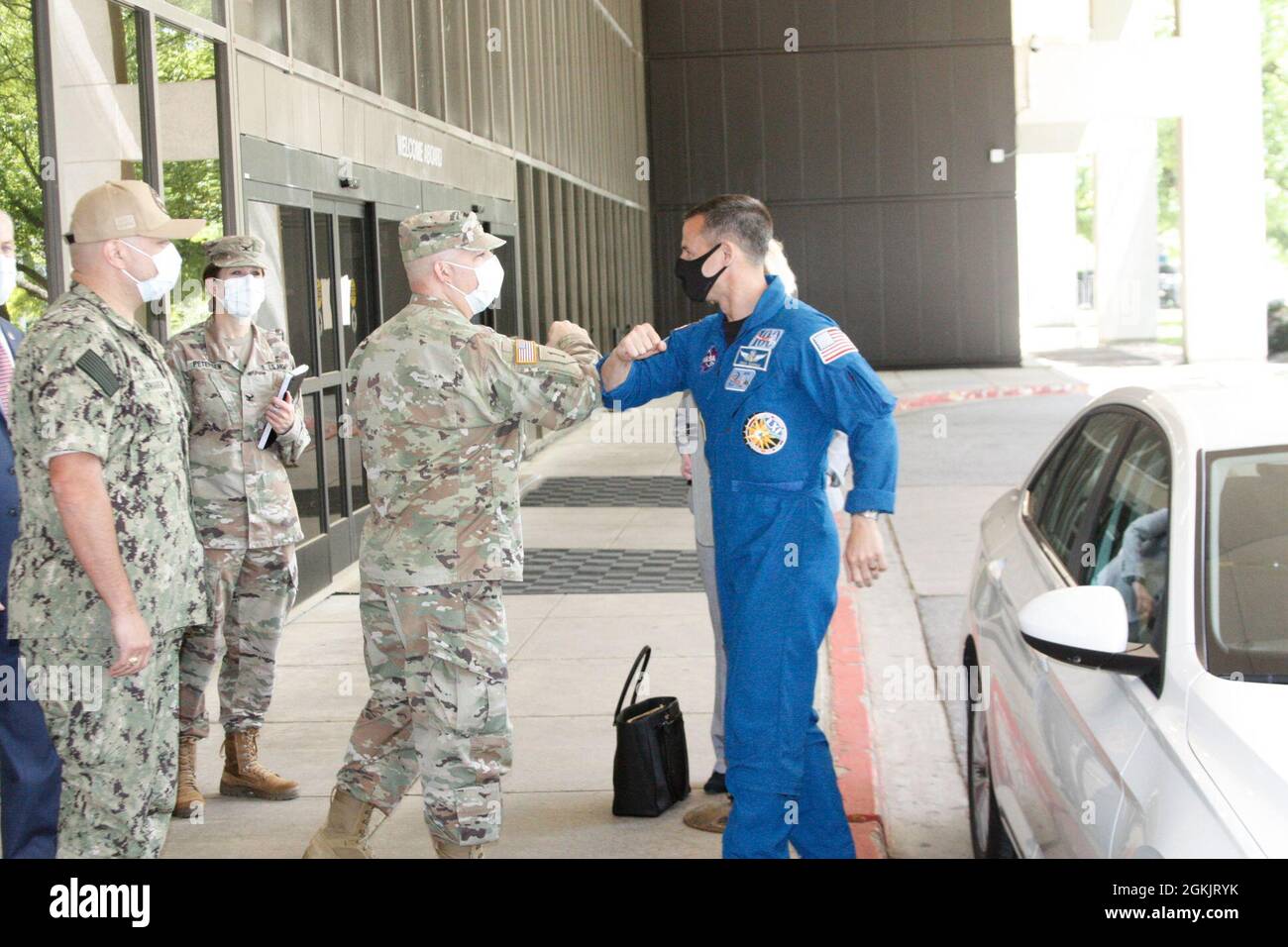 Army Col. (Dr.) Andrew Barr, director of Walter Reed National Military Medical Center (WRNMMC) welcomes NASA astronaut Andrew Morgan back to WRNMMC May 6, where Morgan did some of his medical training as a student at the Uniformed Services University of the Health Sciences. Stock Photo