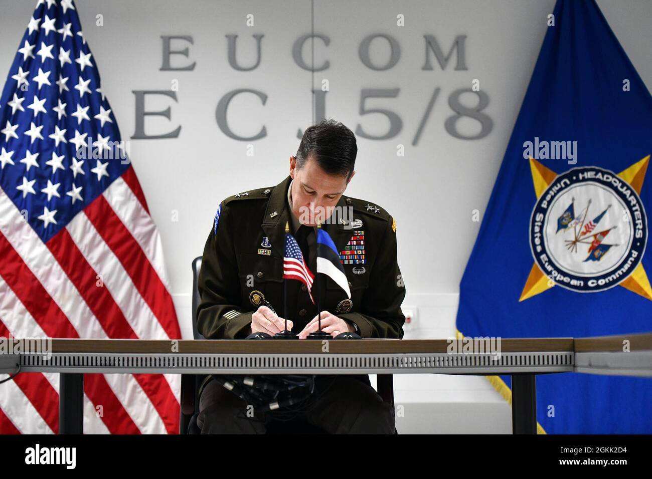 U.S. Army Maj. Gen. Charles Miller, U.S. European Command's Director of plans, policy, strategy and capabilities, signs an agreement to establish an Estonian liaison officer on the USEUCOM headquarters staff during a virtual signing ceremony, May 11, 2021. The Estonian officer is excpeted to arrive this summer and will join liaison officers from 11 other countries in the command's Multinational Coordination Cell. Stock Photo