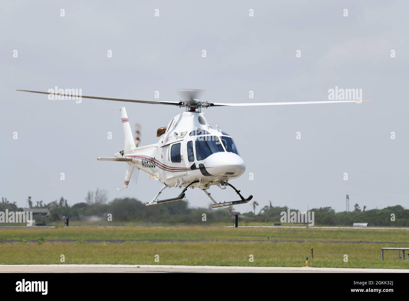 CORPUS CHRISTI, Texas (May 11, 2021)  - A TH-119 helicopter piloted by Chief of Naval Air Training Chief of Staff Capt. Scott Starkey lands at Naval Air Station Corpus Christi, May 11. The TH-119 is the commercially available variant of the TH-73A, which will replace the TH-57 Sea Ranger to meet advanced rotary wing and intermediate tilt-rotor training requirements for the Navy, Marine Corps and Coast Guard through 2050. Stock Photo