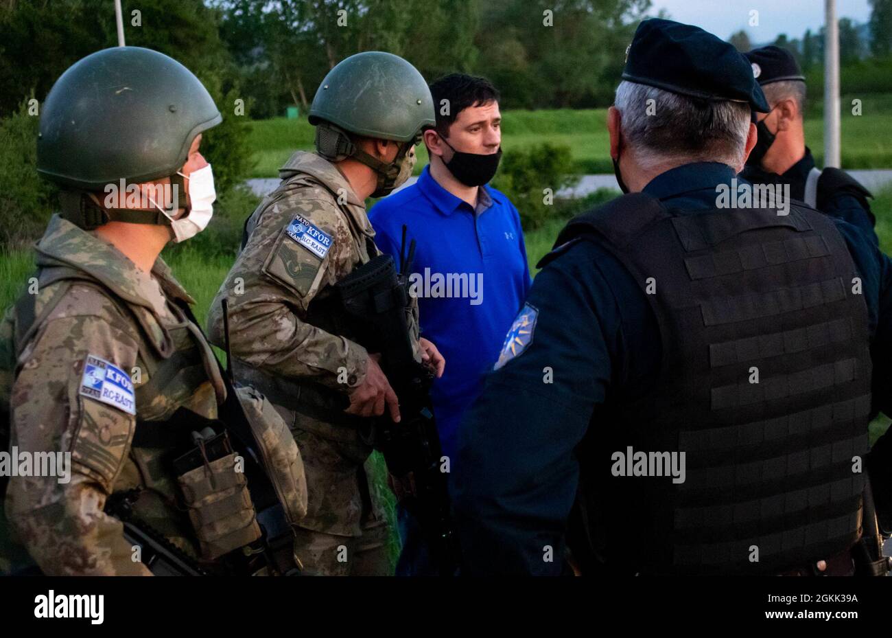 Turkish Armed Forces soldiers assigned to Regional Command-East, Kosovo  Force, and members of the Kosovo Police speak through a translator during a  night patrol in Ranilluk/Ranilug, Kosovo, on May 11, 2021. The
