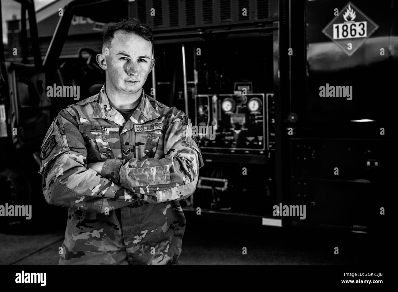 U.S. Air Force Senior Airman Johnathan Lauro, 633rd Logistics Readiness Squadron Fuels Center Service controller, poses for a photo with a fuel truck at Joint Base Langley-Eustis, Virginia, May 11, 2021. To ensure mission requirements are met Lauro coordinates with various organizations to dispatch fuel-truck drivers to aircraft, verify billing, account for all equipment, and ensure fuel supply.” Stock Photo