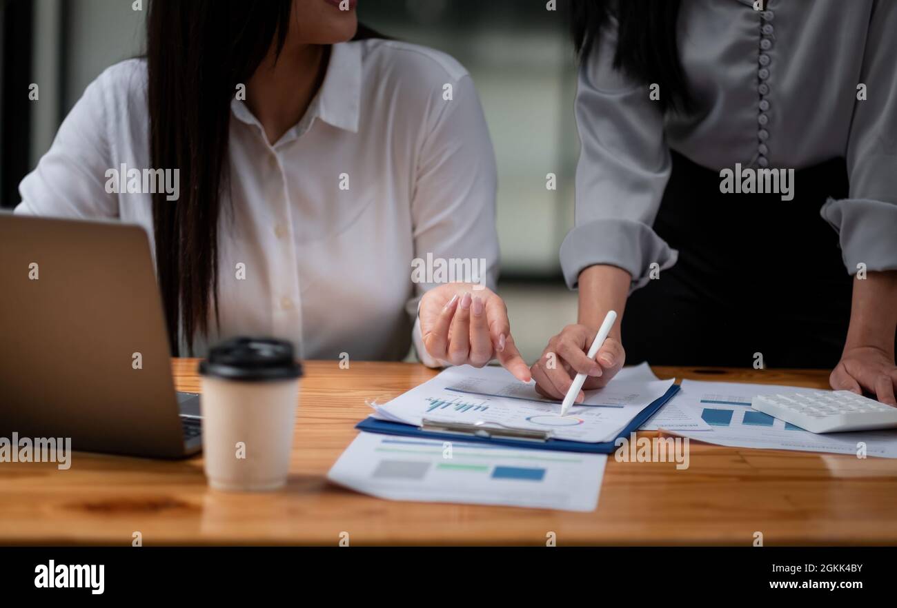 Business adviser analyzing financial figures denoting the progress in the work, consult concept Stock Photo