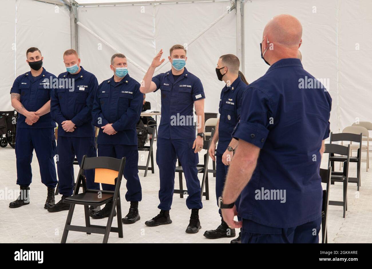 Coast Guardsmen participate in a group discussion with U.S. Coast Guard